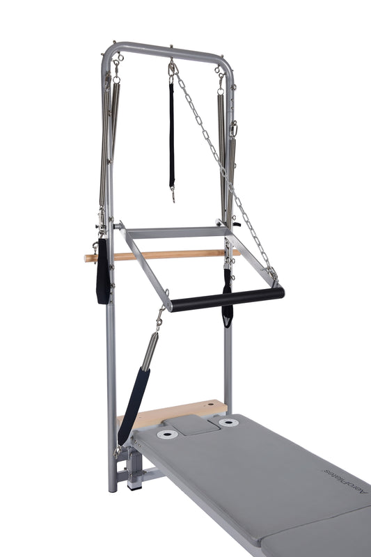 Pilates reformer machine on a white background