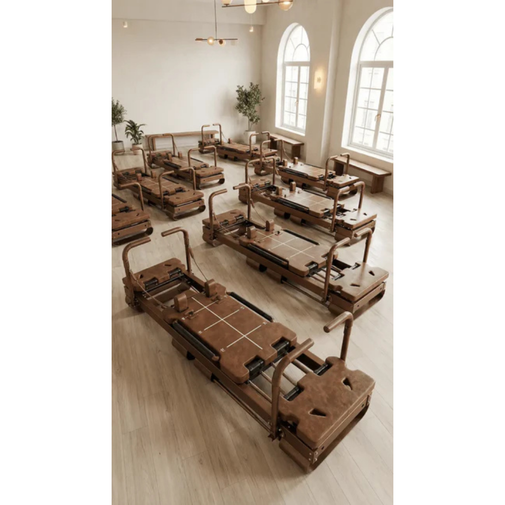 Core Collab SculptFormer Lagree-style reformer in studio setting, multiple units
