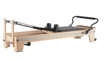 Core Collab Eco Studio Full Track Pilates Reformer, wooden frame, side view