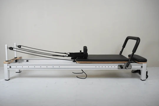 Core Collab Full Track Queen Studio Pilates Reformer, black frame, side view