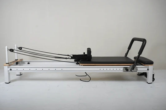 Core Collab Full Track Queen Studio Pilates Reformer, black frame, side view